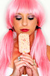 Female Model in Pink wig eating an ice cream bar
