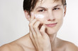 Man applying cream