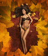 Cute woman laying on the leaves