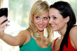 Teenage Girlfriends Taking Photographs. Model Released