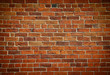 Weathered stained old brick wall