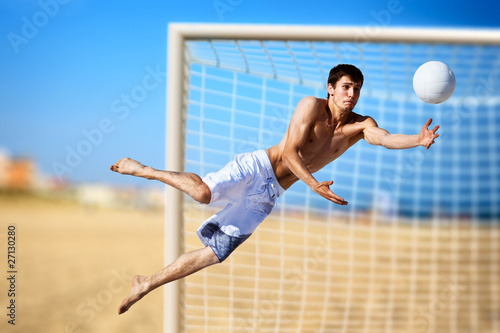 Photo: Young man playing soccer Young man playing soccer
