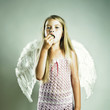 Beautiful happy girl with angel wings