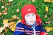 The boy in park in the autumn
