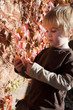 little boy playing with autumn leaves