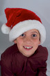 close up of boy with santa hat