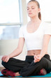 Young woman doing yoga exercises
