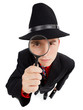 Young detective with magnifier