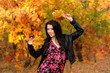 The girl brunette in autumn wood