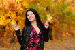 The girl brunette in autumn wood