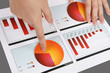 Woman Pointing at Graph