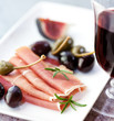 Jamon Serrano with olives, caper berries and figs
