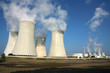 smoking power plant in agriculture field under blue sky