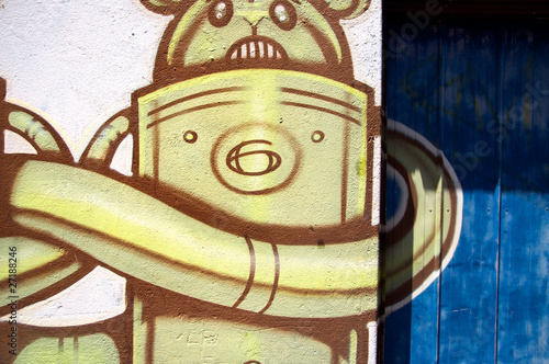 Photo: Modern style graffiti on brick wall. Modern style graffiti on brick wall.
