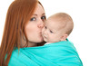 mother carrying little boy three month old sitting in sling