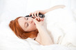 speaking on the phone woman in white bedding speaking on the phone woman in white bedding