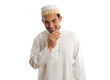 Smiling ethnic man in traditional robe and topi