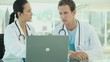 Medical Professionals Using a Laptop