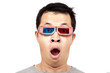 Young man with 3D glasses on watching a 3D movie .
