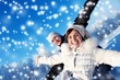 Happy smiling couple on a winter background