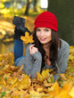 Beautiful woman spending time in park during autumn season