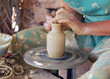close up of the hands of a potter