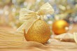 golden christmas decorations with ribbon