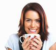 Closeup of an attractive female holding coffee cup and smiling