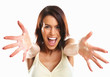 Excited young woman pointing with both hands towards the camera