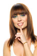 Young girl with her finger over her mouth