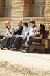 Friends Talking On A Bench