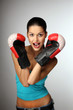 Photo: Young beautiful women wiht boxing gloves. Young beautiful women wiht boxing gloves.