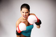 Young beautiful women wiht boxing gloves.