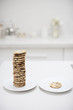 stack of cookies on plate next to single cookie on plate