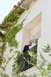 well-dressed senior couple on balcony