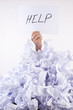 Businessman overwhelmed by the paper
