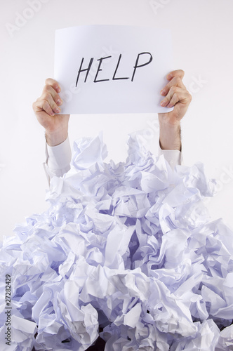 Photo: Businessman overwhelmed by the paper Businessman overwhelmed by the paper