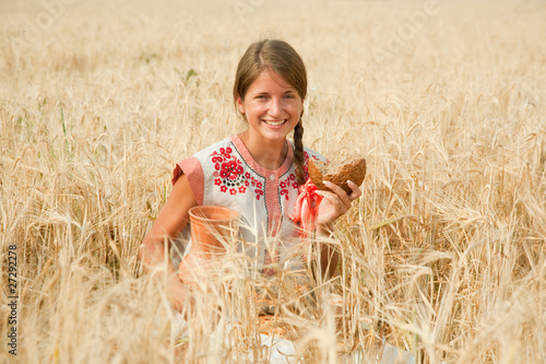 Photo: Girl with bread at rye field Girl with bread at rye field