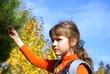 The schoolgirl against autumn wood