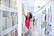 pretty young college student in an university library (shallow D
