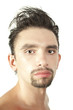 Portrait of a young brunette man with a stylish haircut