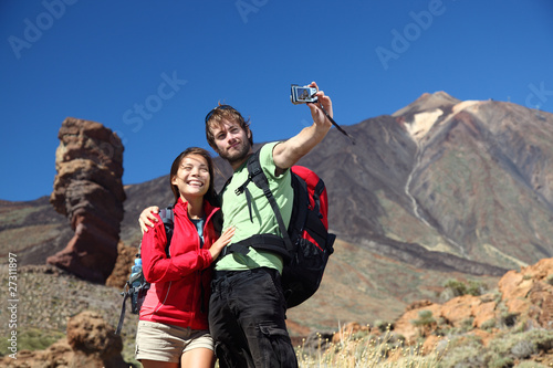 Photo: Couple taking picture on holidays Couple taking picture on holidays