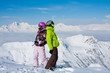 Photo: Young happy couple in winter mountains Young happy couple in winter mountains