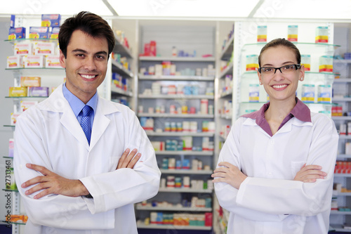 Photo: portrait of pharmacists at pharmacy portrait of pharmacists at pharmacy