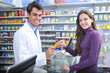 Photo: Pharmacist and client at pharmacy Pharmacist and client at pharmacy