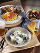 Rollmops with green apples,salmon scrambled eggs and fruit salad