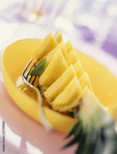 Photo: quarter of a pineapple cut in slices quarter of a pineapple cut in slices