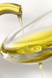 dash of olive oil filling spoon