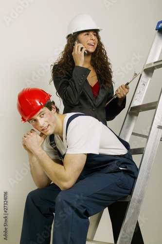 Photo: People With Construction Hats At Work People With Construction Hats At Work