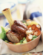 Veal knuckle with lobster and vegetables